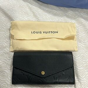 Louis Vuitton wallet.
